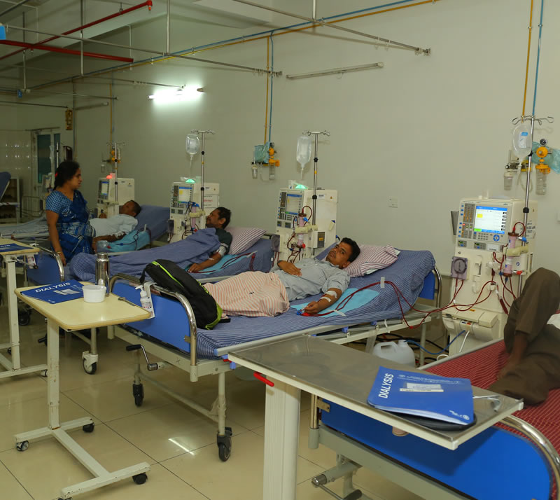 Nursing staff attending to patients on dialysis machines at a BKF centre