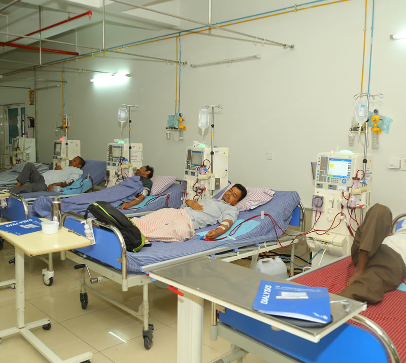 Patients receiving haemodialysis on beds with dialysis machines at a BKF centre